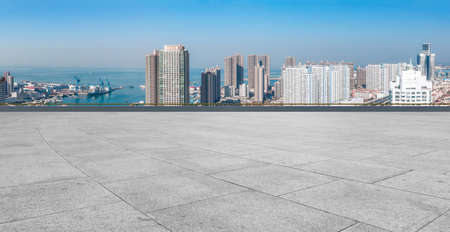 Floor tile observation deck and city building landscapeの写真素材