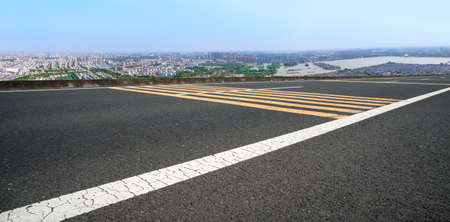 Highway lanes and financial district buildingsの写真素材