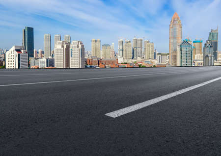 Highway lanes and financial district buildingsの写真素材