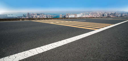 Asphalt ground and urban building landscapeの写真素材