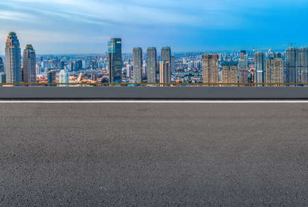 Asphalt floors and financial district buildingsの写真素材