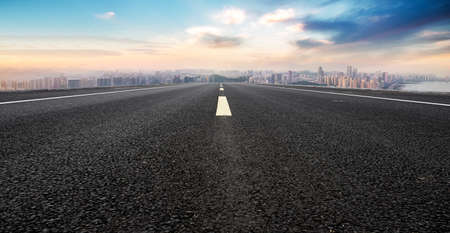 Asphalt floors and financial district buildingsの写真素材