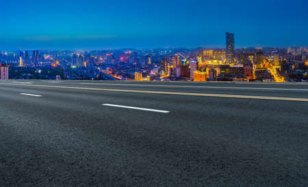 Asphalt floors and financial district buildingsの写真素材
