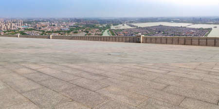 Floor tile observation deck and city building landscapeの写真素材