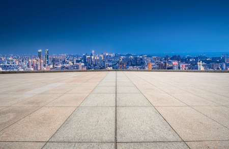 Floor tile observation deck and city building landscapeの写真素材