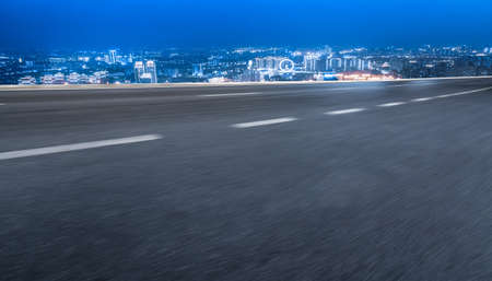 Night view of the road ahead and financial district buildingsの写真素材