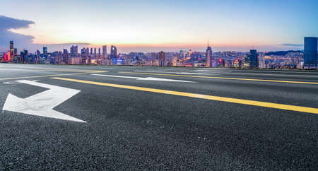 Night view of the road ahead and financial district buildingsの写真素材