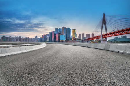 Asphalt road and financial district buildings landscapeの写真素材