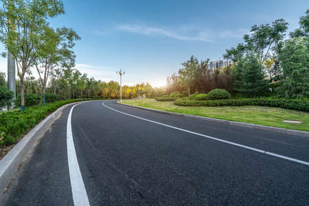 Asphalt highway skyline and garden nature sceneryの写真素材