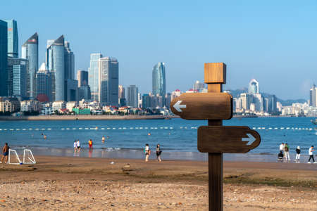 Beach road signs and modern skyscrapersの写真素材