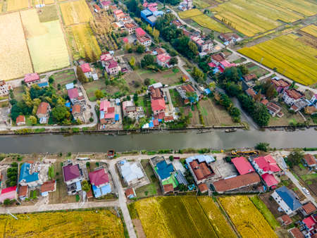 Aerial photography of country houses and farmlandの写真素材