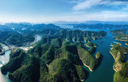 Aerial photography outdoor green mountains and green water, lake waterscapeの写真素材