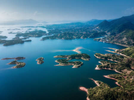 Aerial photography outdoor green mountains and green water, lake waterscapeの写真素材