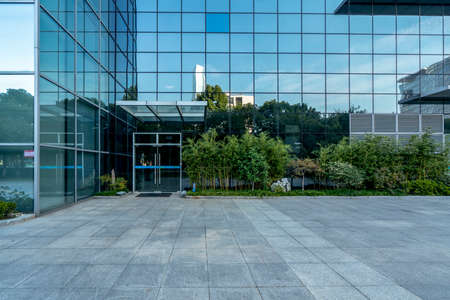 Partial view and glass of modern buildings in outdoor financial districtの写真素材