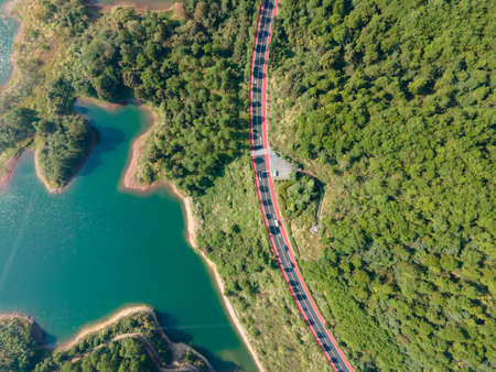 Aerial photography outdoor forest curve road close-upの写真素材