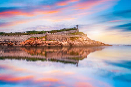 Aerial photography of the ancient building ruins of Penglai Pavilion on the coastline and the sky and cloudsの写真素材