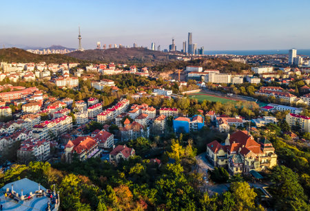 Aerial photography of Qingdao coastline architectural landscape at duskの写真素材