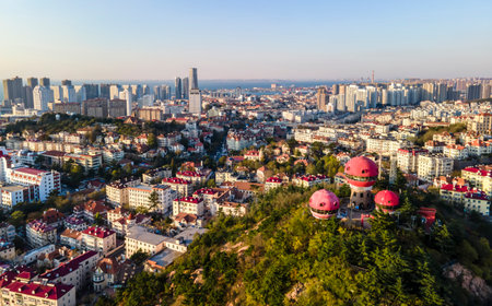 Aerial photography of Qingdao coastline architectural landscape at duskの写真素材