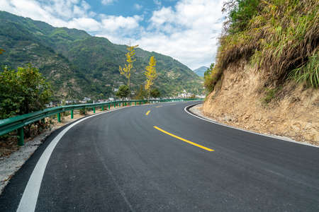 Asphalt road curves and natural sceneryの写真素材