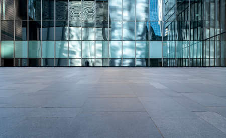 Square brick floor and modern office buildingの写真素材