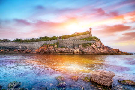 Aerial photography of ancient architectural ruins of Penglai Pavilion on the coastlineの写真素材
