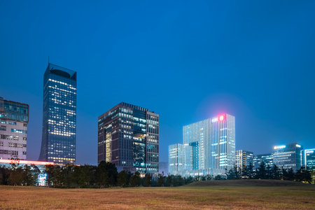 Night view of office buildings in central business districtの写真素材