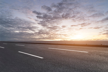 Outdoor highway lanes and sky cloudsの写真素材