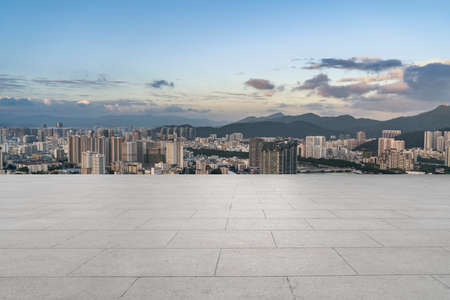 Floor tile observation deck and city building landscapeの写真素材