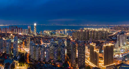 Aerial photography of Qingdao city buildings at nightの写真素材