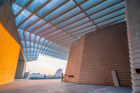 Glass roof and partial view of modern building in financial districtの写真素材