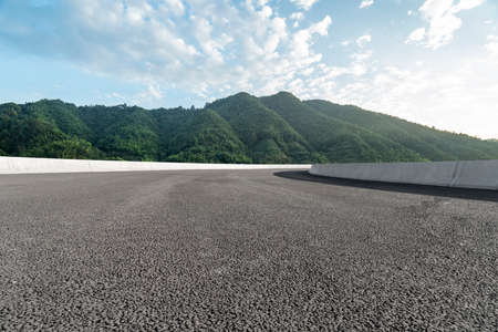Road ground and green hills backgroundの写真素材