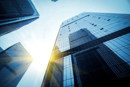Partial landscaping and glass curtain wall of the office building in the outdoor financial districtの写真素材