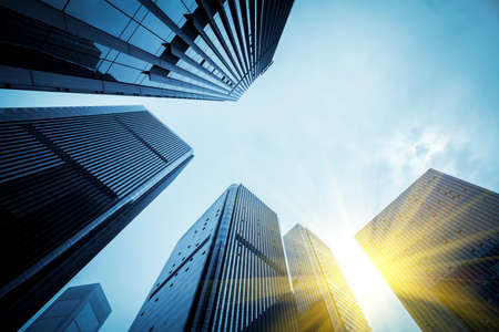 Partial landscaping and glass curtain wall of the office building in the outdoor financial districtの写真素材