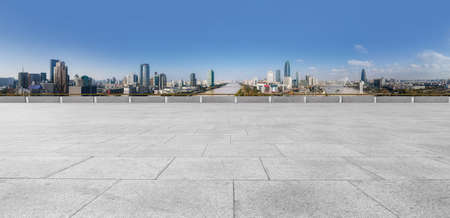 Floor tile observation deck and city building landscapeの写真素材