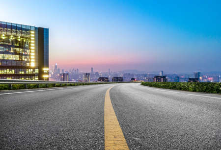 Night view of asphalt ground and city buildings landscapeの写真素材