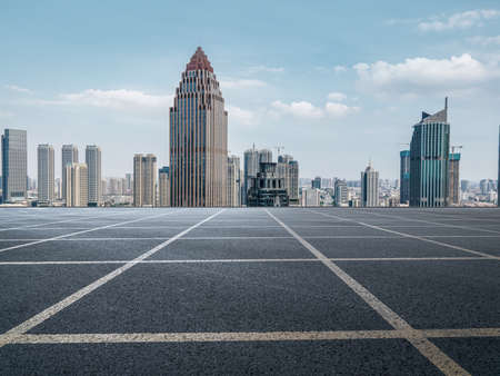 Asphalt ground and urban building landscapeの写真素材