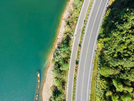 Aerial photography outdoor forest asphalt roadの写真素材