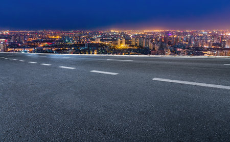 Night view of asphalt skyline and financial district buildingsの写真素材