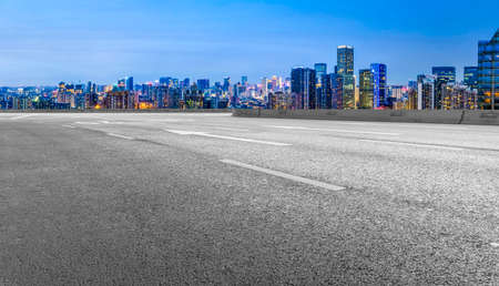 Night view of asphalt skyline and financial district buildingsの写真素材