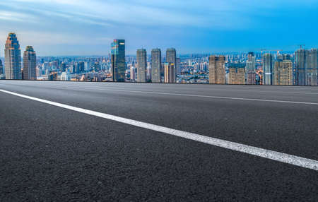The road ahead and the city's financial district buildingsの写真素材