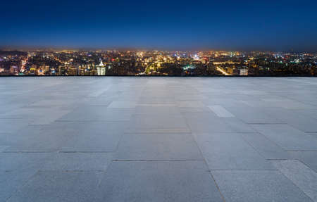 Night view of road ground and city buildings landscapeの写真素材