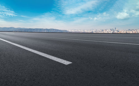 The road ahead and the city's financial district buildingsの写真素材