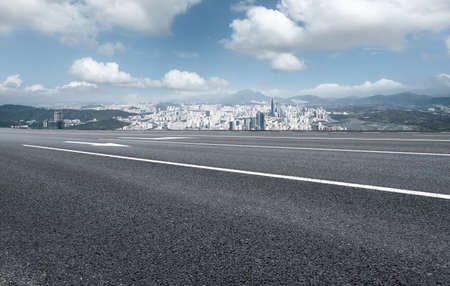 Highway lane and urban building landscapeの写真素材
