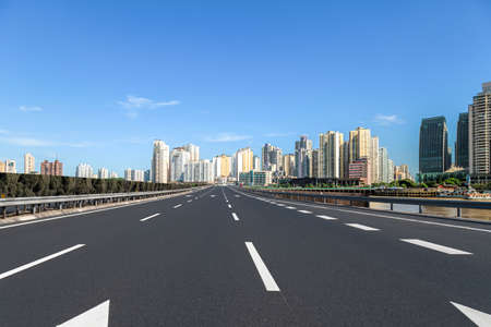 Highway lane and urban building landscapeの写真素材