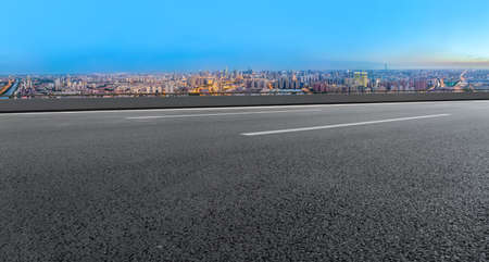 Highway lane and urban building landscapeの写真素材