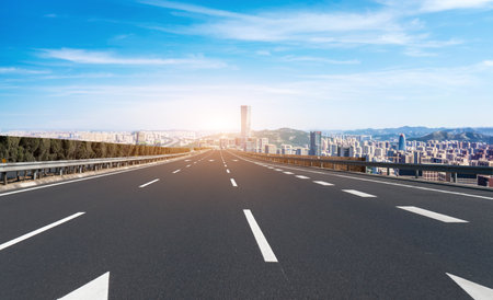Asphalt road ground and urban modern buildingsの写真素材