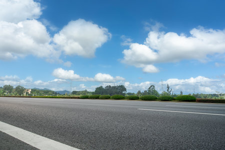 Asphalt road ground and urban modern buildingsの写真素材