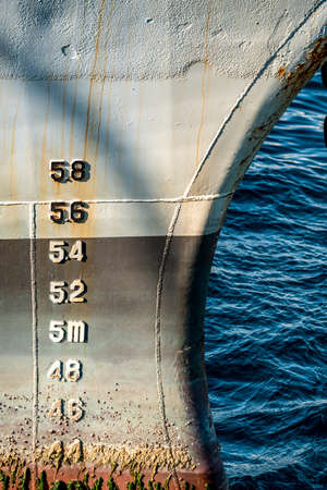 Close-up of cog line of freighter at city coastline pierの写真素材