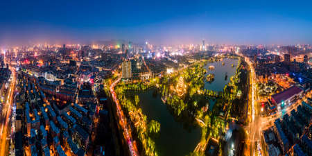 Aerial photography night view of Daming Lake Park in Jinanの写真素材