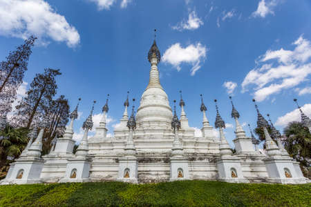 Street scene of ancient white pagoda buildings in Southeast Asiaの写真素材